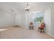 Bright dining area with wood-look floors and two chairs at 11346 Laffite Pl, Port Charlotte, FL 33981