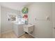 Laundry room with washer, dryer, and utility sink at 11346 Laffite Pl, Port Charlotte, FL 33981