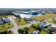 Aerial view of commercial building near waterfront with parking and surrounding buildings at 1217 Aqui Esta Dr # 5, Punta Gorda, FL 33950