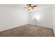 Spacious bedroom with ceiling fan and carpet flooring at 1217 Aqui Esta Dr # 5, Punta Gorda, FL 33950