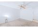 Spacious bedroom with ceiling fan and carpeted floor at 1217 Aqui Esta Dr # 5, Punta Gorda, FL 33950