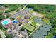 Aerial view of community amenities including pool, tennis courts, and clubhouse at 13264 Creekside Ln, Port Charlotte, FL 33953