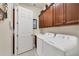 Convenient laundry room with washer, dryer, and ample cabinetry at 13264 Creekside Ln, Port Charlotte, FL 33953