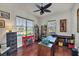 Bright home office with built-in shelving and hardwood floors at 13264 Creekside Ln, Port Charlotte, FL 33953