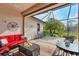 Red couch and wicker furniture on a spacious screened patio at 13264 Creekside Ln, Port Charlotte, FL 33953