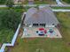 Home with a large backyard patio and fenced-in yard at 13536 Ainsworth Ln, Port Charlotte, FL 33981