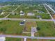 Aerial view showing home, neighborhood, and canal at 13536 Ainsworth Ln, Port Charlotte, FL 33981