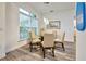 Casual dining area with glass table and four beige chairs at 13536 Ainsworth Ln, Port Charlotte, FL 33981