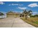 Three car garage and a large driveway at 13536 Ainsworth Ln, Port Charlotte, FL 33981