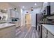 Kitchen features grey cabinets, stainless steel appliances, and quartz countertops at 13536 Ainsworth Ln, Port Charlotte, FL 33981