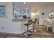 Modern kitchen with breakfast bar and grey cabinets at 13536 Ainsworth Ln, Port Charlotte, FL 33981