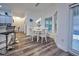 Kitchen nook with white table and chairs, near the kitchen at 13536 Ainsworth Ln, Port Charlotte, FL 33981