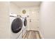 Laundry room with side-by-side washer and dryer at 13536 Ainsworth Ln, Port Charlotte, FL 33981