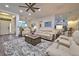 Open concept living room with a view into the kitchen and entryway at 13536 Ainsworth Ln, Port Charlotte, FL 33981