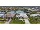 Aerial view of waterfront home with private dock and lush landscaping at 1431 Grebe Dr, Punta Gorda, FL 33950