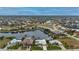 Wide aerial showcasing waterfront property and surrounding homes at 1431 Grebe Dr, Punta Gorda, FL 33950