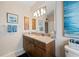 Well-lit bathroom with vanity and granite countertop at 1431 Grebe Dr, Punta Gorda, FL 33950