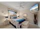 Bright bedroom with coastal decor and a ceiling fan at 1431 Grebe Dr, Punta Gorda, FL 33950