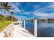 Spacious dock with bench seating and beautiful canal views at 1431 Grebe Dr, Punta Gorda, FL 33950