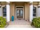 Front entry with double doors and tiled flooring at 1431 Grebe Dr, Punta Gorda, FL 33950