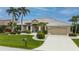 Beautiful one-story house with landscaping and driveway at 1431 Grebe Dr, Punta Gorda, FL 33950