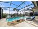 Enclosed pool and spa with patio furniture and water view at 1431 Grebe Dr, Punta Gorda, FL 33950