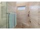 Spacious shower with glass enclosure and built-in shelving at 1431 Grebe Dr, Punta Gorda, FL 33950