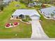 Single-story home with a landscaped yard and driveway, aerial view at 157 Valdiva St, Punta Gorda, FL 33983