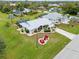 Aerial view of single-story home with landscaped yard and driveway at 157 Valdiva St, Punta Gorda, FL 33983