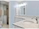 Updated bathroom with double vanity, quartz countertop, and shower at 157 Valdiva St, Punta Gorda, FL 33983