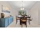 Bright dining room features a table with chairs and a stylish blue cabinet at 157 Valdiva St, Punta Gorda, FL 33983