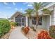 Landscaped front yard with a walkway leading to the screened entryway at 157 Valdiva St, Punta Gorda, FL 33983