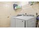 Laundry room with washer, dryer, and shelving at 157 Valdiva St, Punta Gorda, FL 33983