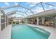 Relaxing pool area with covered patio at 157 Valdiva St, Punta Gorda, FL 33983