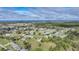 Aerial view of a suburban neighborhood with houses and green areas at 16161 Juarez Cir, Punta Gorda, FL 33955