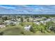 Aerial view showing a community of houses with a lot of green space at 16161 Juarez Cir, Punta Gorda, FL 33955