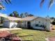 Front view of a single story house with a large yard at 16161 Juarez Cir, Punta Gorda, FL 33955