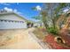 Front yard view showcasing the house exterior and landscaping at 16161 Juarez Cir, Punta Gorda, FL 33955