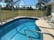 Inviting kidney-shaped pool with a screened enclosure at 16161 Juarez Cir, Punta Gorda, FL 33955