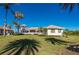 Landscaped backyard showcasing the home's exterior at 17557 Ohara Dr, Port Charlotte, FL 33948