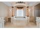 Elegant bathroom with a large soaking tub, and and vanities at 17557 Ohara Dr, Port Charlotte, FL 33948