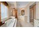 Luxurious bathroom with a soaking tub, double vanity, and separate shower at 17557 Ohara Dr, Port Charlotte, FL 33948