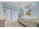 Bedroom with a post bed, light blue walls, and window at 17557 Ohara Dr, Port Charlotte, FL 33948