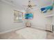 Bedroom with a ceiling fan, large window, and ocean mural at 17557 Ohara Dr, Port Charlotte, FL 33948