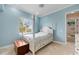 Bedroom with a post bed, light blue walls, and window at 17557 Ohara Dr, Port Charlotte, FL 33948