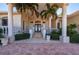 Elegant entryway with double doors, columns and a chandelier at 17557 Ohara Dr, Port Charlotte, FL 33948