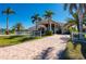 Impressive home with a circular driveway and lush landscaping at 17557 Ohara Dr, Port Charlotte, FL 33948