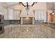 Large kitchen island, granite countertops and custom cabinetry at 17557 Ohara Dr, Port Charlotte, FL 33948