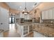 Elegant kitchen featuring granite countertops and custom cabinetry at 17557 Ohara Dr, Port Charlotte, FL 33948