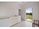 Laundry room with exterior access and built-in storage at 17557 Ohara Dr, Port Charlotte, FL 33948